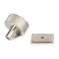 The 32mm Knurled Cabinet Knob on a Square Rose in Satin Stainless Steel Shown from Behind on a White Background The 32mm Knurled Cabinet Knob on a Square Rose in Satin Stainless Steel Shown from Behind on a White Background
