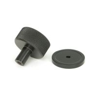 The 32mm Knurled Cabinet Knob on Plain Rose in Aged Bronze Shown from Behind with the Rose The 32mm Knurled Cabinet Knob on Plain Rose in Aged Bronze Shown from Behind with the Rose