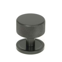 The 32mm Knurled Cabinet Knob on Plain Rose in Aged Bronze Shown Upright on a White Background The 32mm Knurled Cabinet Knob on Plain Rose in Aged Bronze Shown Upright on a White Background