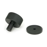 The 32mm Knurled Cabinet Knob on Plain Rose in Matt Black Shown from Behind on a White Background The 32mm Knurled Cabinet Knob on Plain Rose in Matt Black Shown from Behind on a White Background