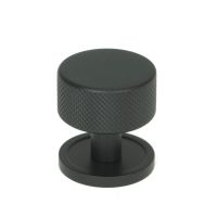 The 32mm Knurled Cabinet Knob on Plain Rose in Matt Black Shown Upright on a White Background The 32mm Knurled Cabinet Knob on Plain Rose in Matt Black Shown Upright on a White Background