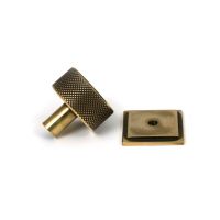 The 32mm Knurled Cabinet Knob on Square Rose in Aged Brass Shown from Behind with the Rose The 32mm Knurled Cabinet Knob on Square Rose in Aged Brass Shown from Behind with the Rose
