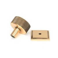 The 32mm Knurled Cabinet Knob on Square Rose in Polished Bronze Shown from Behind on a White Background The 32mm Knurled Cabinet Knob on Square Rose in Polished Bronze Shown from Behind on a White Background