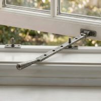 The 335mm 12" Pewter Five Pin Window Stay Fitted on a Classic White Window Frame - Digital Illustration The 335mm 12" Pewter Five Pin Window Stay Fitted on a Classic White Window Frame - Digital Illustration