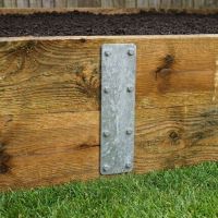 The 350mm Pre-Galvanised Railway Sleeper Straight Joining Plate on a Wooden Timber Raised Garden Planter - Digital Illustration The 350mm Pre-Galvanised Railway Sleeper Straight Joining Plate on a Wooden Timber Raised Garden Planter - Digital Illustration
