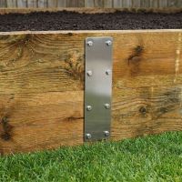 The 350mm Stainless Steel Railway Sleeper Straight Joining Plate on a Raised Planter - Digital Illustration The 350mm Stainless Steel Railway Sleeper Straight Joining Plate on a Raised Planter - Digital Illustration
