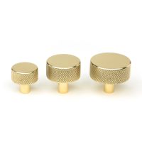 The 38mm Knurled Cabinet Knob (No Rose) in Polished Brass Alongside Different Sizes on a White Background The 38mm Knurled Cabinet Knob (No Rose) in Polished Brass Alongside Different Sizes on a White Background
