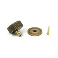 The 38mm Knurled Cabinet Knob on a Plain Rose in Aged Brass Showing the Separate Components and Supplied Fitting The 38mm Knurled Cabinet Knob on a Plain Rose in Aged Brass Showing the Separate Components and Supplied Fitting