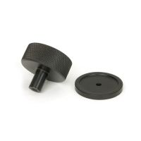The 38mm Knurled Cabinet Knob on a Plain Rose in Aged Bronze Shown from Behind on a White Background The 38mm Knurled Cabinet Knob on a Plain Rose in Aged Bronze Shown from Behind on a White Background