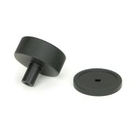 The 38mm Knurled Cabinet Knob on a Plain Rose in Matt Black Shown from Behind on a White Background The 38mm Knurled Cabinet Knob on a Plain Rose in Matt Black Shown from Behind on a White Background