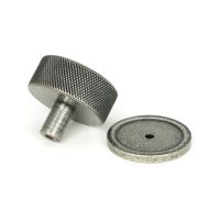The 38mm Knurled Cabinet Knob on a Plain Rose in Pewter Shown from Behind on a White Background The 38mm Knurled Cabinet Knob on a Plain Rose in Pewter Shown from Behind on a White Background