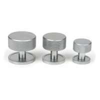 The 38mm Knurled Cabinet Knob on a Plain Rose in Satin Chrome Next to Other Available Sizes on a White Background The 38mm Knurled Cabinet Knob on a Plain Rose in Satin Chrome Next to Other Available Sizes on a White Background