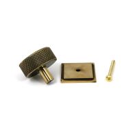 The 38mm Knurled Cabinet Knob on a Square Rose in Aged Brass Showing the Separate Components and Supplied Fitting The 38mm Knurled Cabinet Knob on a Square Rose in Aged Brass Showing the Separate Components and Supplied Fitting