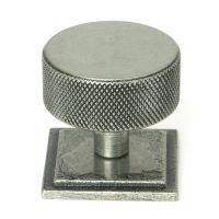 The 38mm Knurled Cabinet Knob on a Square Rose in Pewter Shown Upright on a White Background The 38mm Knurled Cabinet Knob on a Square Rose in Pewter Shown Upright on a White Background
