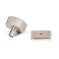 The 38mm Knurled Cabinet Knob on a Square Rose in Satin Stainless Steel Shown from Behind on a White Background The 38mm Knurled Cabinet Knob on a Square Rose in Satin Stainless Steel Shown from Behind on a White Background