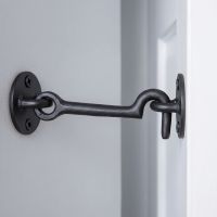 The 3" Simplistic Iron Cabin Hook Mounted on a Door in a Modern Home - Digital Illustration 