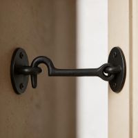 The 3" Simplistic Iron Cabin Hook Shown Fitted on a Cream Coloured Door - Digital Illustration  