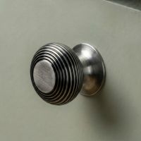 The 40mm "Garrison" Ribbed Beehive Knob in a Pewter Finish Fitted on to a Sage Green Kitchen Cupboard - Digital Illustration The 40mm "Garrison" Ribbed Beehive Knob in a Pewter Finish Fitted on to a Sage Green Kitchen Cupboard - Digital Illustration
