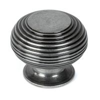 The 40mm _Garrison_ Ribbed Beehive Knob in Pewter on a White Background Stood Upright 