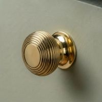 The 40mm Individual Aged Brass Beehive Cabinet Knob Mounted on a Sage Green Kitchen Cupboard Drawer - Digital Illustration The 40mm Individual Aged Brass Beehive Cabinet Knob Mounted on a Sage Green Kitchen Cupboard Drawer - Digital Illustration