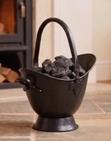 The 43cm "Waterloo" Black Iron Coal Bucket Placed on a Stone Tile Floor in Front of a Log Burner Stove - Digital Illustration The 43cm "Waterloo" Black Iron Coal Bucket Placed on a Stone Tile Floor in Front of a Log Burner Stove - Digital Illustration