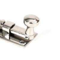 The 4" Polished Stainless Steel Universal Door & Window Bolt Close up of the Handle The 4" Polished Stainless Steel Universal Door & Window Bolt Close up of the Handle