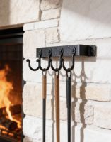 The 4 Hook "Blacksmith Style" Wall Mounted Fireside Tool Rack Mounted on a White Brick Wall Next to a Lit Fire - Digital Illustration The 4 Hook "Blacksmith Style" Wall Mounted Fireside Tool Rack Mounted on a White Brick Wall Next to a Lit Fire - Digital Illustration