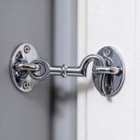 The 4 Inch Bright Chrome Cabin Hooks Loose Ring Type Shown Holding a Door Open in a Home - Digital Illustration