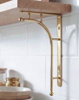 The 50 x 24cm Kepler Modern Polished Brass Bracket Mounted in a Modern Kitchen on a white Tiled wall - Digital Illustration The 50 x 24cm Kepler Modern Polished Brass Bracket Mounted in a Modern Kitchen on a white Tiled wall - Digital Illustration