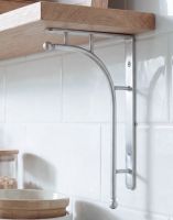 The 50 x 24cm ’Kepler’ Polished Aluminium Modern Wall Bracket Mounted on a White Tiled Kitchen Wall in a Modern Home - Digital Illustration The 50 x 24cm ’Kepler’ Polished Aluminium Modern Wall Bracket Mounted on a White Tiled Kitchen Wall in a Modern Home - Digital Illustration