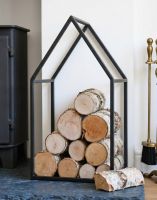 The 55cm"Town House" Iron Log Rack with some Birch Logs in a White Living Room next to a Log Burner Stove - Digital Illustration The 55cm"Town House" Iron Log Rack with some Birch Logs in a White Living Room next to a Log Burner Stove - Digital Illustration