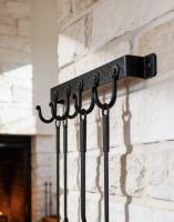 The 5 Hook "Blacksmith Style" Wall Mounted Fireside Tool Rack Mounted on a Traditional White Brick Wall in a Rustic Home - Digital Illustration The 5 Hook "Blacksmith Style" Wall Mounted Fireside Tool Rack Mounted on a Traditional White Brick Wall in a Rustic Home - Digital Illustration