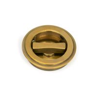 The 60mm Art Deco Round Sliding Pocket Door Privacy Set in Aged Brass Showing the Thumb Turn Section