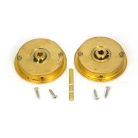 The 60mm Art Deco Round Sliding Pocket Door Privacy Set in Polished Brass Shown with Supplied Spindle and Fitting Screws