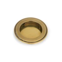 The 75mm Art Deco Round Flush Pull Handle in Aged Brass Shown from the Front on a White Background