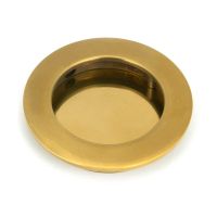 The 75mm Classic Round Flush Pull Handle in Aged Brass Shown from the Front on a White Background