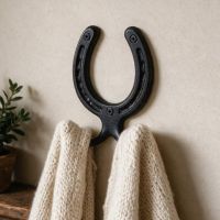The 75mm Iron Horse Shoe Hook Mounted on a Wall in a Cosy Home Hallway - Digital Illustration 