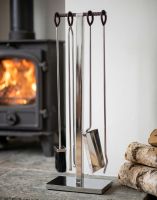 The 76cm “Baxter Loft” Stainless Steel and Leather Companion Set on a Stone Hearth next to a Log Burner Stove - Digital Illustration 