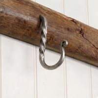 The 89mm Blacksmith Pewter Cup Hook Mounted on a Wooden Beam in a Country Kitchen - Digital Illustration The 89mm Blacksmith Pewter Cup Hook Mounted on a Wooden Beam in a Country Kitchen - Digital Illustration
