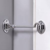 The 8 Inch Bright Chrome Cabin Hooks Silent Type Heavy on a White Door in a Modern Home Interior - Digital Illustration 