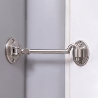 The 8 Inch Satin Chrome Cabin Hooks Silent Type Heavy  on a White Door in a Modern Home Interior - Digital Illustration
