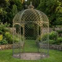 The Chatsworth Domed Wrought Iron Garden Gazebo in an Antique Green Finish on a Patio in a Low Walled Garden - Digital Illustration The Chatsworth Domed Wrought Iron Garden Gazebo in an Antique Green Finish on a Patio in a Low Walled Garden - Digital Illustration
