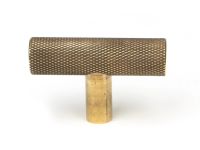The Aged Brass "Astor" Knurled Industrial T-Bar Cabinet Fitting Shown on a White Background Front on