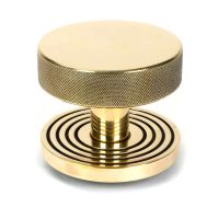 The Aged Brass Knurled Centre Door Knob on Beehive Rose Shown Upright on a White Background The Aged Brass Knurled Centre Door Knob on Beehive Rose Shown Upright on a White Background
