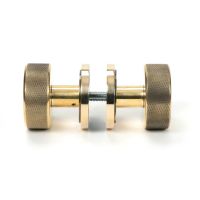The Aged Brass Knurled Mortice/Rim Knob Set on an Art Deco Rose Shown Screwed Together from the Side The Aged Brass Knurled Mortice/Rim Knob Set on an Art Deco Rose Shown Screwed Together from the Side