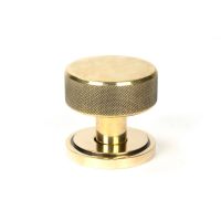 The Aged Brass Knurled Mortice/Rim Knob Set on an Art Deco Rose Shown Upright The Aged Brass Knurled Mortice/Rim Knob Set on an Art Deco Rose Shown Upright