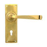 The Aged Brass Sleek Architectural Lever Lock Door Handle Set on Plain Backplate The Aged Brass Sleek Architectural Lever Lock Door Handle Set on Plain Backplate