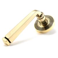 The Aged Brass Tapered Lever on Beehive Rose Set on a White Background The Aged Brass Tapered Lever on Beehive Rose Set on a White Background