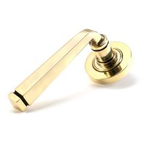 The Aged Brass Tapered Lever on Plain Rose Set on a White Background The Aged Brass Tapered Lever on Plain Rose Set on a White Background