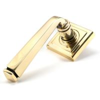 The Aged Brass Tapered Lever on Square Rose Set on a White Background The Aged Brass Tapered Lever on Square Rose Set on a White Background